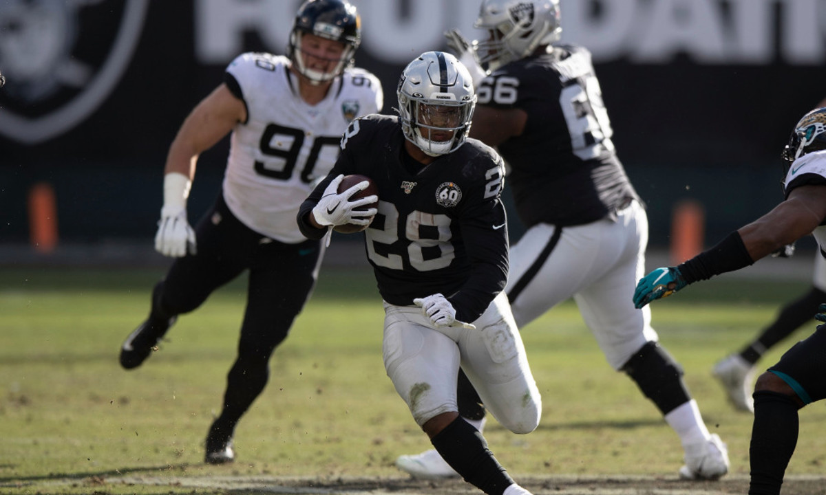 OAKLAND, CA - DECEMBER 15: Running back Josh Jacobs #28 of the Oakland Raiders rushes up field against the Jacksonville Jaguars during the second quarter at RingCentral Coliseum on December 15, 2019 in Oakland, California.  (Photo by Jason O. Watson/Getty Images)