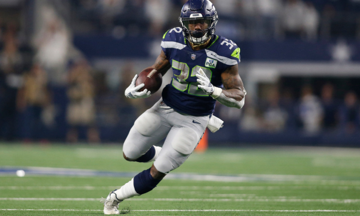 Jan 5, 2019; Arlington, TX, USA; Seattle Seahawks running back Chris Carson (32) runs the ball in the second quarter against the Dallas Cowboys in a NFC Wild Card playoff football game at AT&amp;T Stadium. Mandatory Credit: Tim Heitman-USA TODAY Sports