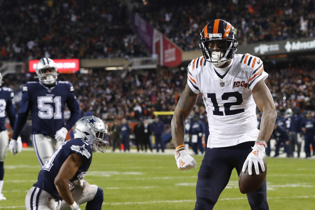 Chicago Bears' Allen Robinson (12) celebrates a touchdown reception during the first half of an NFL football game against the Dallas Cowboys, Thursday, Dec. 5, 2019, in Chicago. (AP Photo/Charles Rex Arbogast)