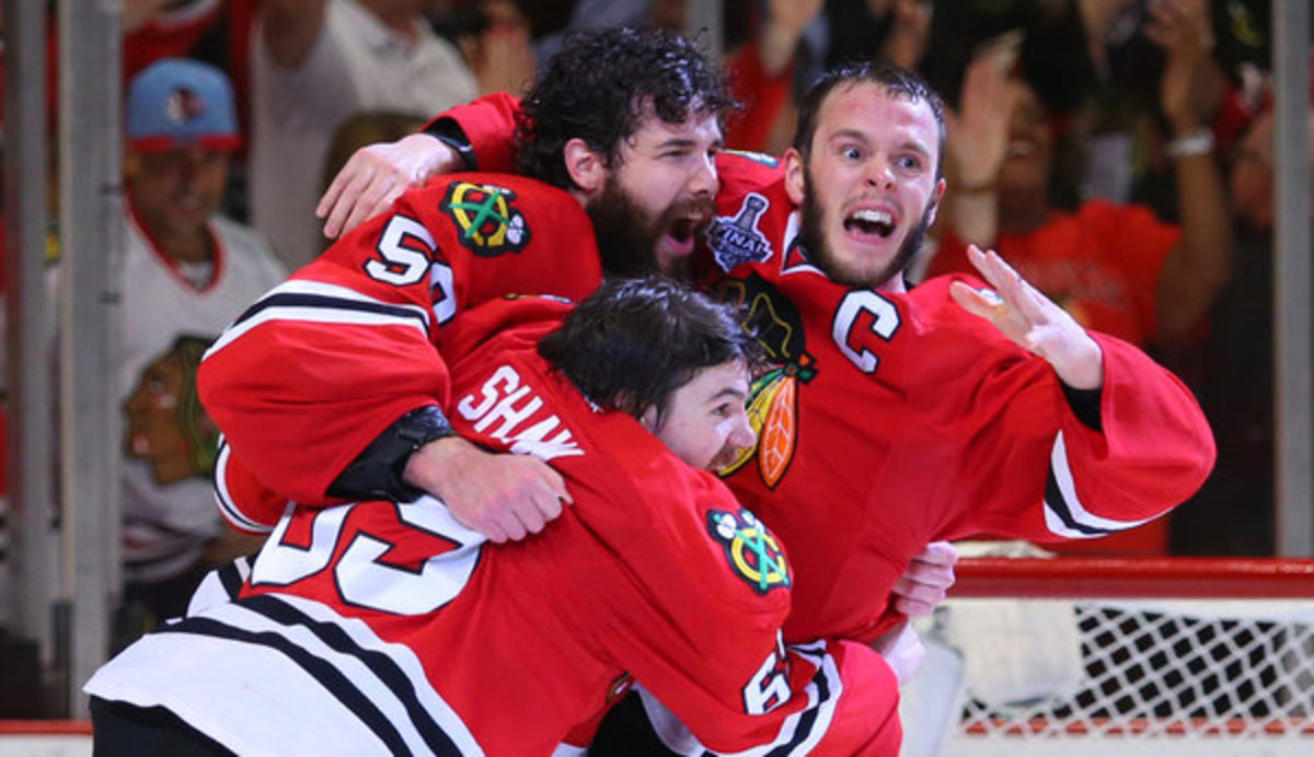 Andrew  Shaw, Corey  Crawford and Jonathan  Toews celebrate 3rd Cup in 6 seasons. (Photo: Jerry Lai/USA Today Sports)