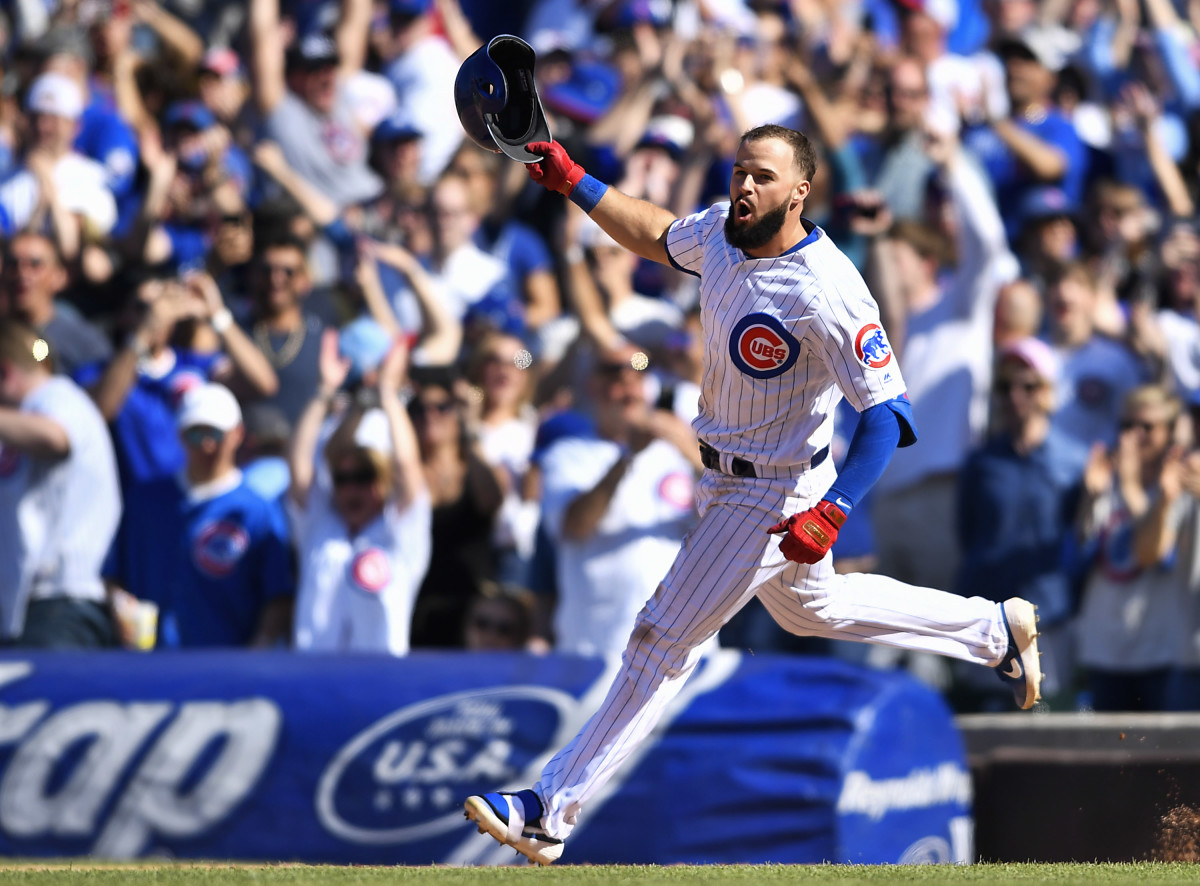 CHICAGO, ILLINOIS - APRIL 21: David Bote #13 of the Chicago Cubs celebrates after hitting a walk-off single against the Arizona Diamondbacks  at Wrigley Field on April 21, 2019 in Chicago, Illinois. (Photo by Quinn Harris/Getty Images)
