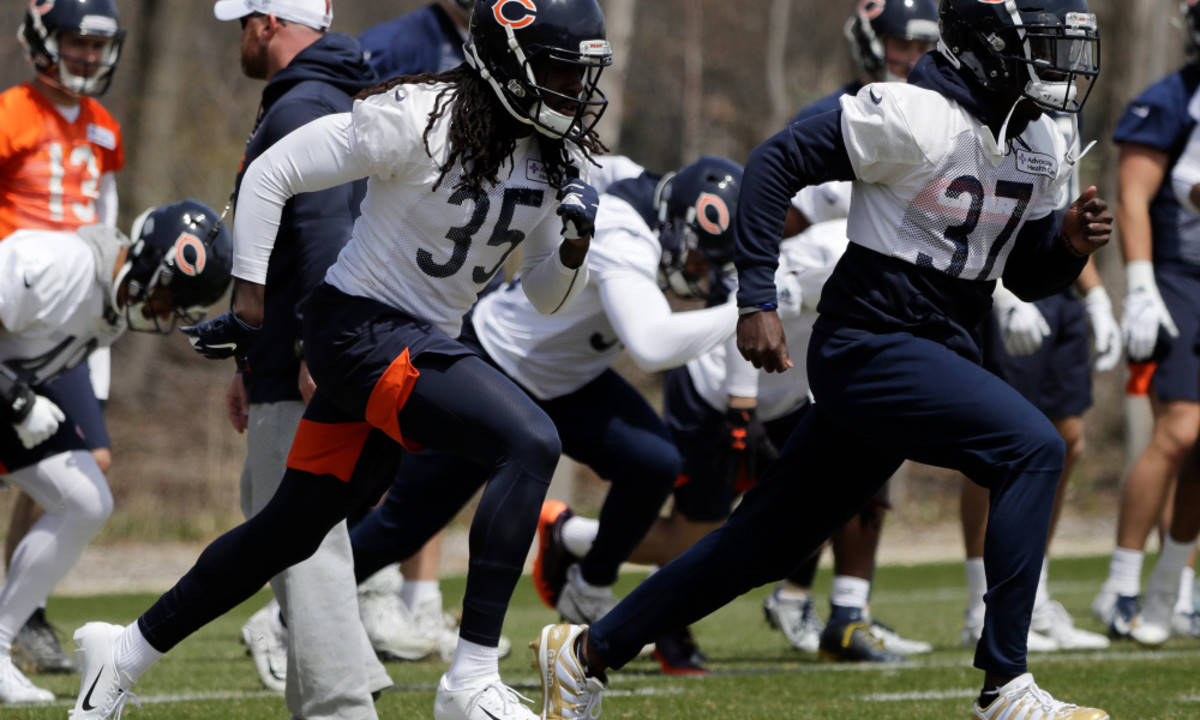 Chicago Bears defensive back Stephen Denmark (35) and defensive back John Franklin III (37) warm up with teammates during the NFL football team's rookie minicamp at Halas Hall, Friday, May 3, 2019, in Lake Forest, Ill. (AP Photo/Nam Y. Huh)