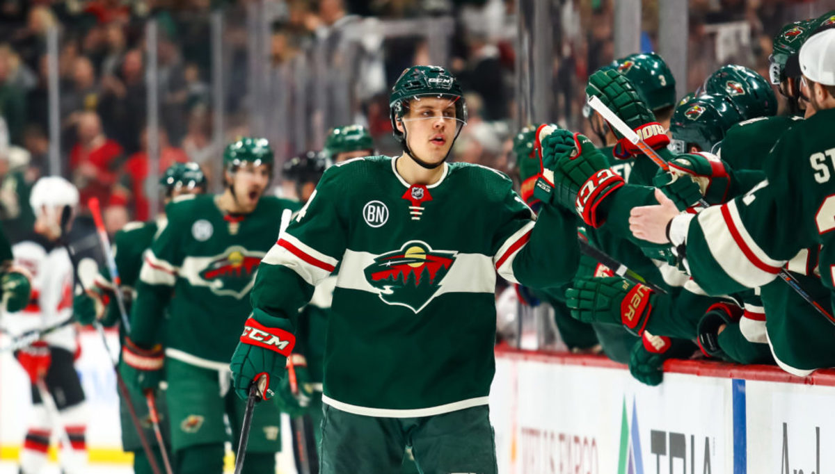 Feb 15, 2019; Saint Paul, MN, USA; Minnesota Wild center Joel Eriksson Ek (14) is congratulated after scoring against the New Jersey Devils in the first period at Xcel Energy Center. Mandatory Credit: David Berding-USA TODAY Sports