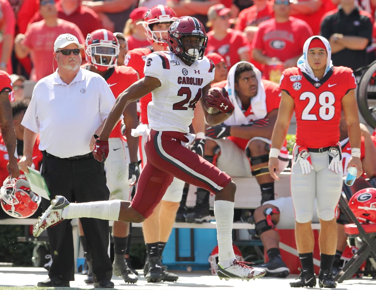 South Carolina defensive back Israel Mukuamu (24) intercepts a Georgia pass for a touchdown during second-quarter action in Athens, Ga. on Saturday, Oct. 12, 2019. (Travis Bell/SIDELINE CAROLINA)