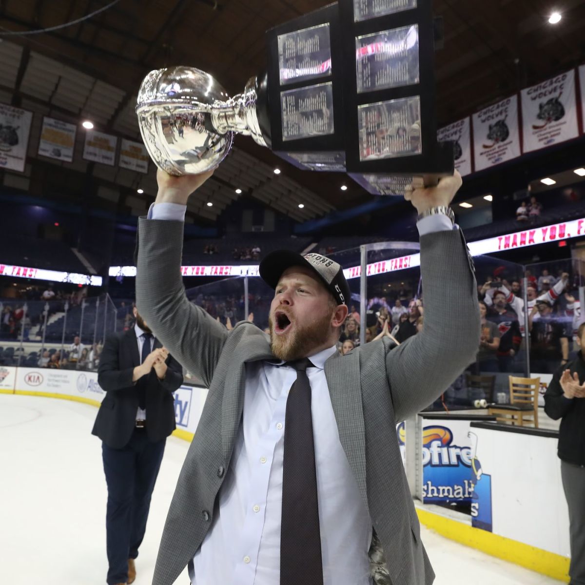 Wolves Head Coach Ryan Warsofsky hoisting the Calder Cup in 2019. Warsofsky was an assistant coach on the Checkers team that beat the Wolves in the 2019 Calder Cup Finals. He was named head coach of the Checkers the following season. Photo: Chicago Wolves