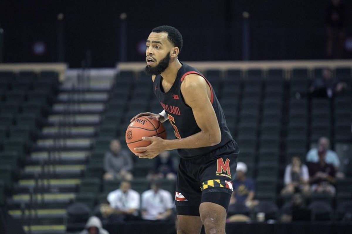 Maryland guard Eric Ayala (5) sets up a play during the second half of an NCAA college basketball tournament game against Temple Thursday, Nov. 28, 2019, in Lake Buena Vista, Fla. (AP Photo/Phelan M. Ebenhack)