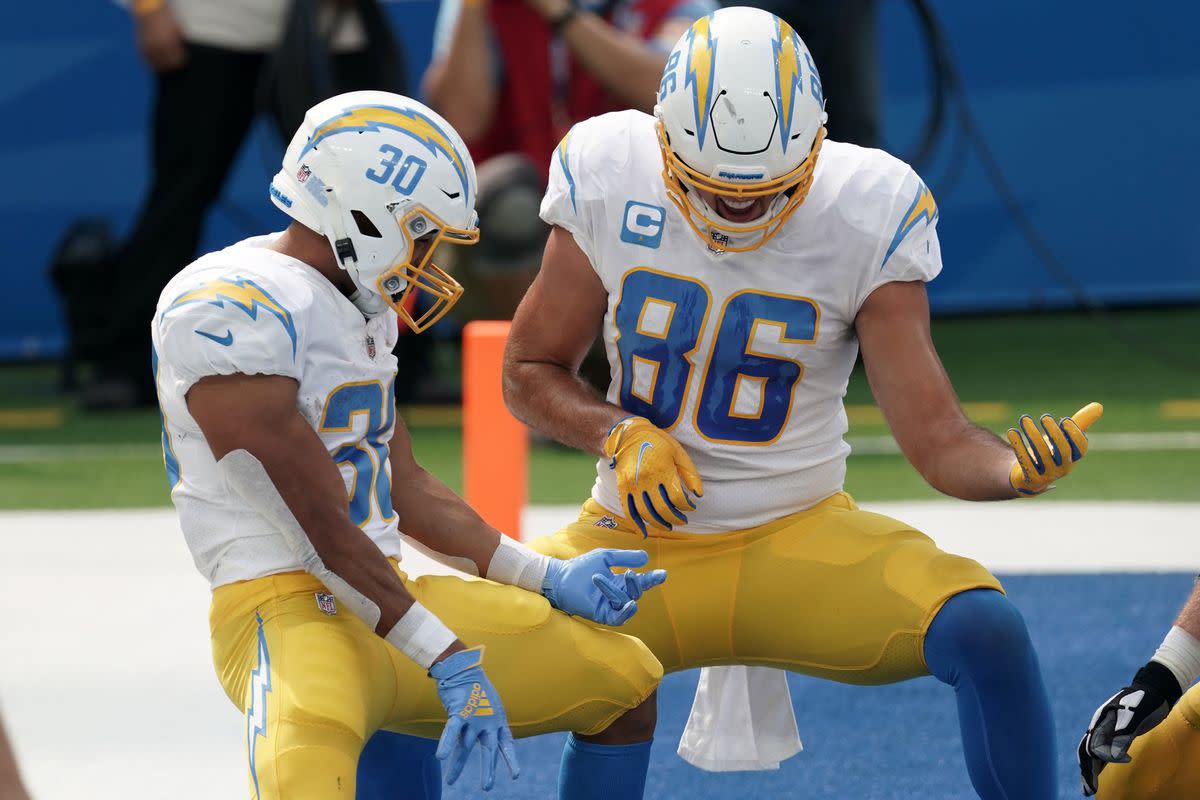 Los Angeles Chargers running back Austin Ekeler celebrates with tight end Hunter Henry after scoring a touchdown in the second quarter against the Carolina Panthers at SoFi Stadium. 