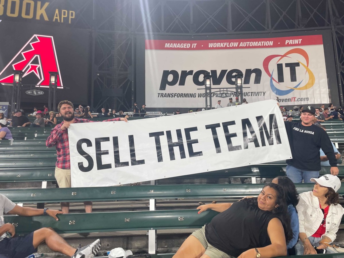 Chicago White Sox fans hoist "Sell The Team" sign in the bleachers at Guaranteed Rate Field