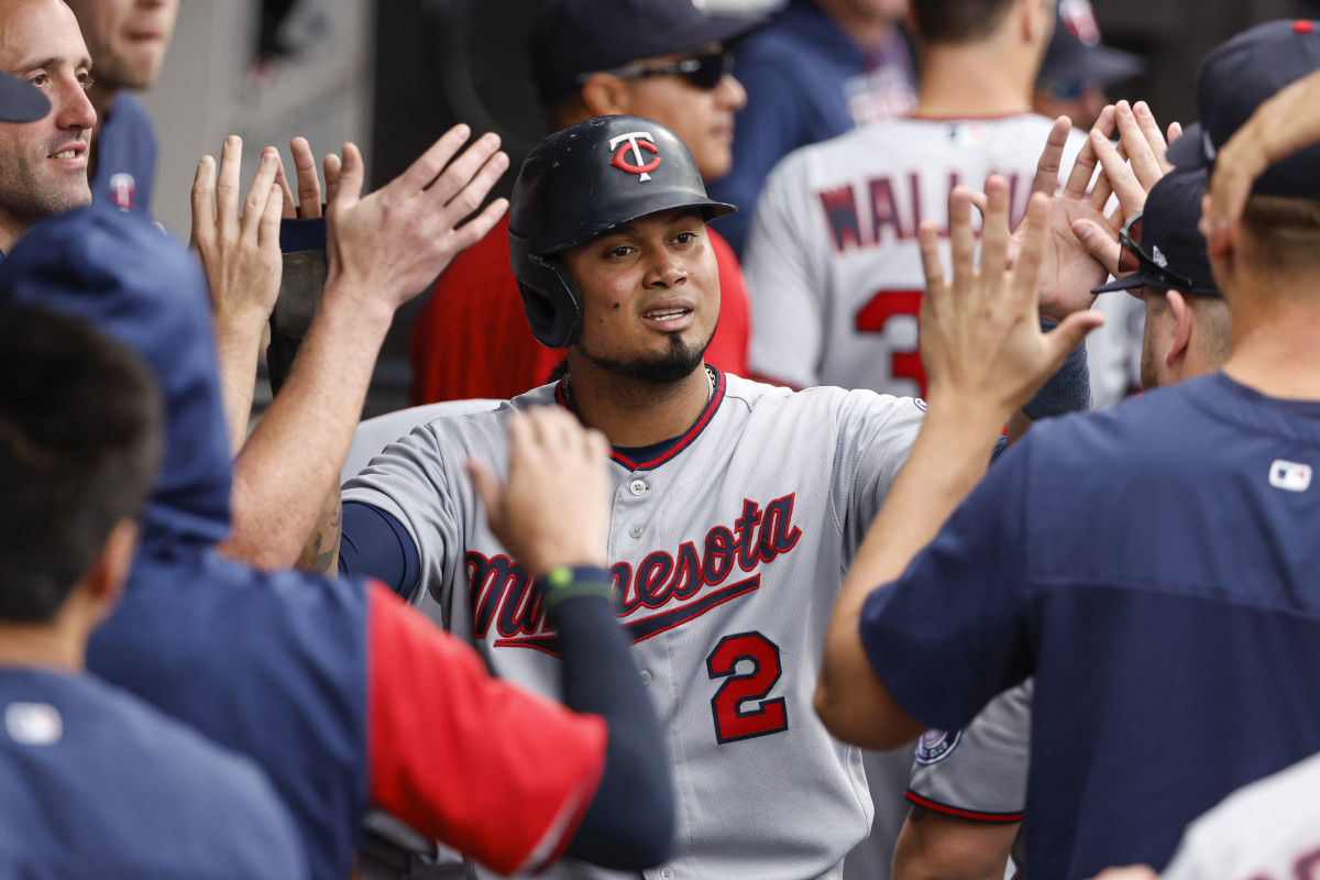 Oct 5, 2022; Chicago, Illinois, USA; Minnesota Twins first baseman Luis Arraez (2) celebrates with teammates after scoring against the Chicago White Sox during the second inning at Guaranteed Rate Field.