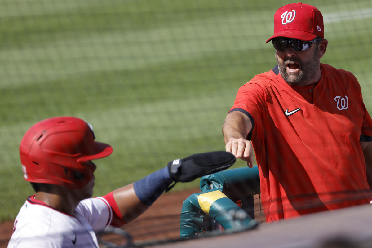 Jun 30, 2021; Washington, District of Columbia, USA; Washington Nationals left fielder Juan Soto (L) celebrates with Nationals hitting coach Kevin Long (R) after scoring a run against the Tampa Bay Rays in the first inning at Nationals Park.