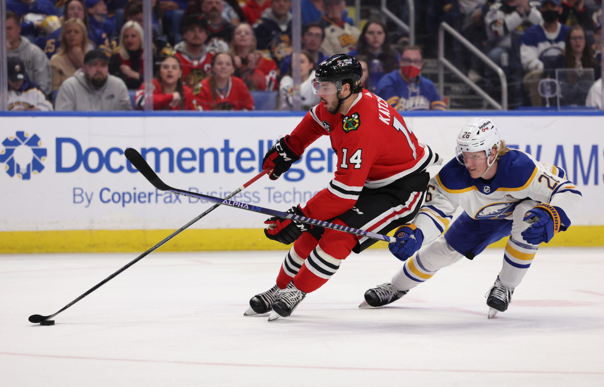 Apr 29, 2022; Buffalo, New York, USA; Chicago Blackhawks left wing Boris Katchouk (14) skates with the puck as Buffalo Sabres defenseman Rasmus Dahlin (26) tries to defend during the third period at KeyBank Center.