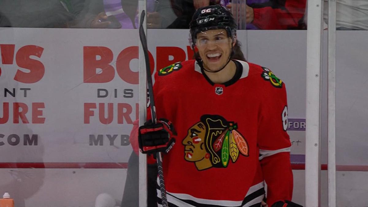 Chicago Blackhawks defenseman Caleb Jones chuckles after being released from the penalty box