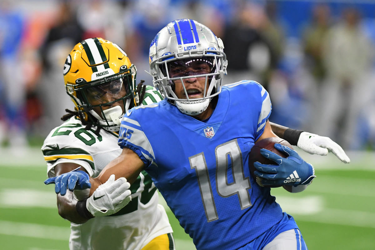 Nov 6, 2022; Detroit, Michigan, USA; Detroit Lions wide receiver Amon-Ra St. Brown (14) heads upfield past Green Bay Packers safety Darnell Savage (26) after catching a pass in the third quarter at Ford Field.