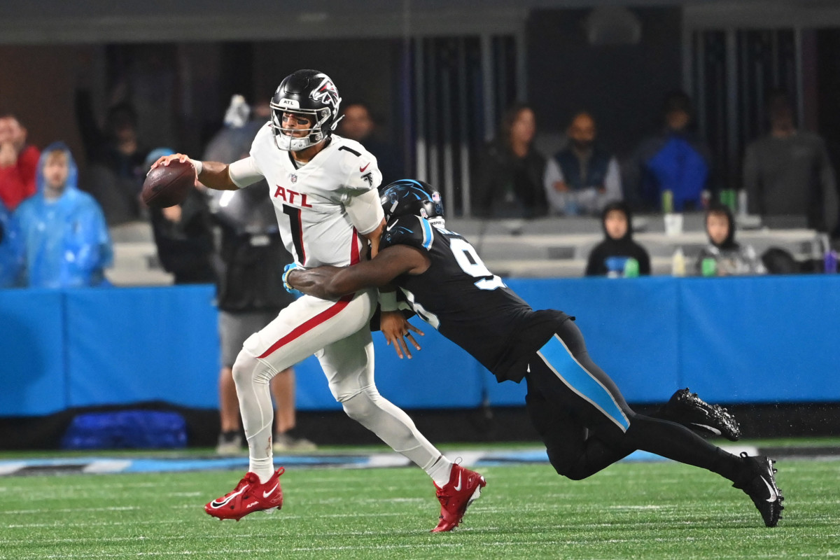 Nov 10, 2022; Charlotte, North Carolina, USA; Carolina Panthers defensive end Marquis Haynes Sr. (98) sacks Atlanta Falcons quarterback Marcus Mariota (1) in the fourth quarter at Bank of America Stadium.