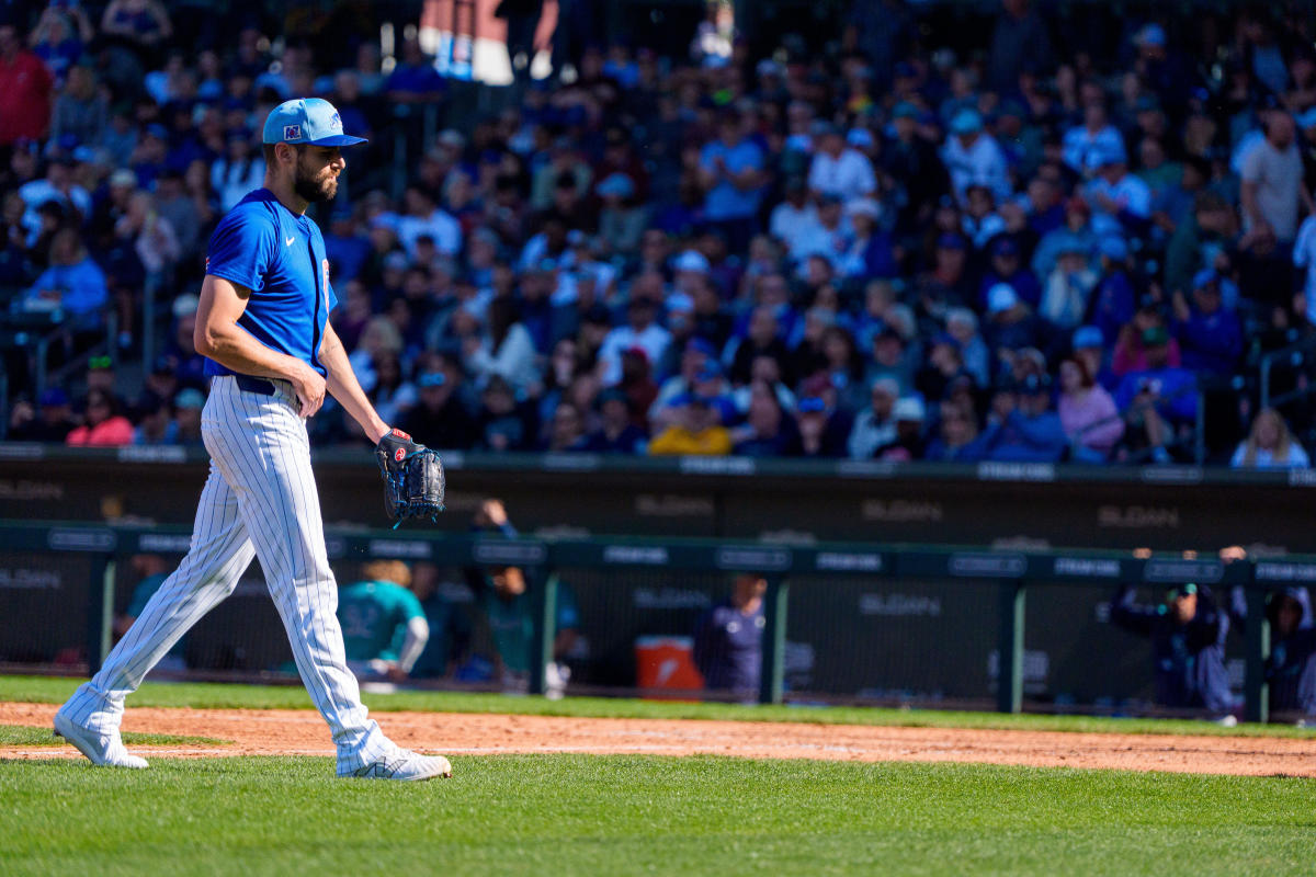 Mar 8, 2025; Mesa, Arizona, USA; Chicago Cubs pitcher Julian Merryweather (66) reacts after pitching in the seventh inning of the spring training game against the Seattle Mariners at Sloan Park.